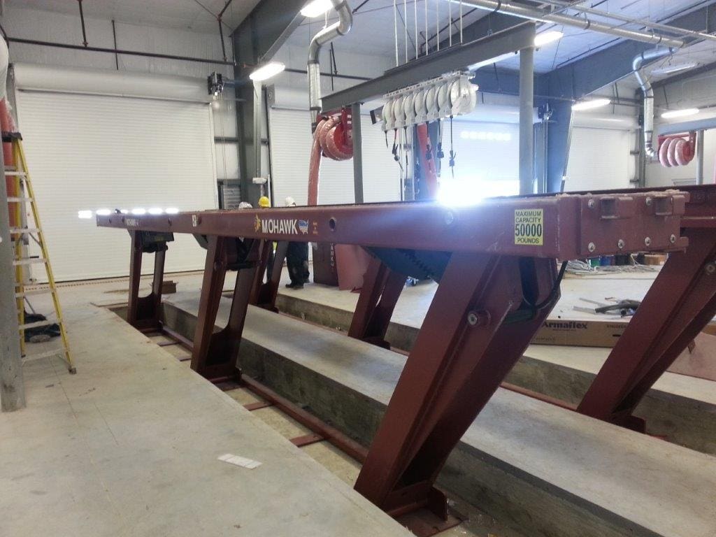 A large metal bench in an industrial setting.