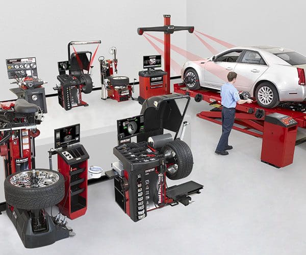 Modern automotive workshop with advanced diagnostic and repair equipment.