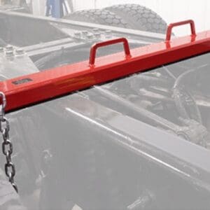 Red steel load bar with chains on truck
